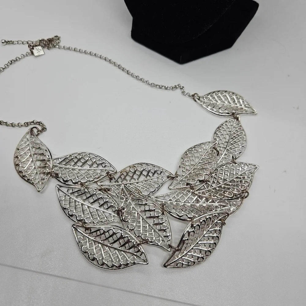 T&R silver tone leaf bib necklace